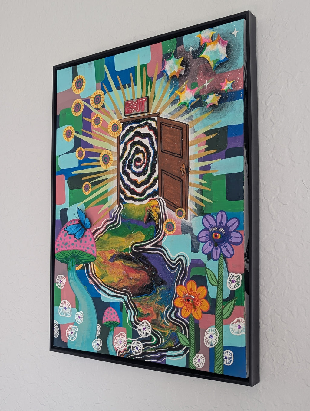 Escaping Wonderland original artwork displayed on a wall